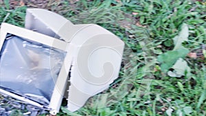 Broken computer on the grass