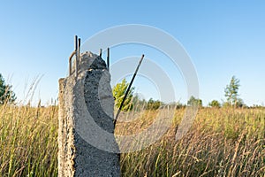 Broken concrete power line pole