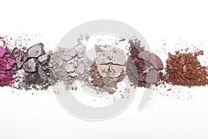 Broken Cosmetic Pigments on light colored background