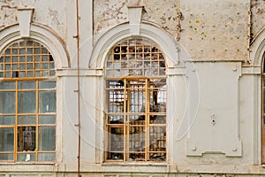 Broken and covered with metal bars windows