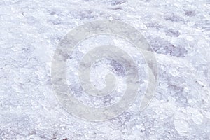 Broken crushed ice fresh cold white winter snow background