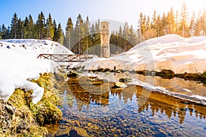 Broken dam in winter mountains