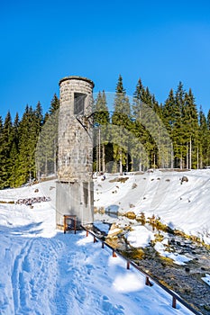 Broken dam in winter mountains