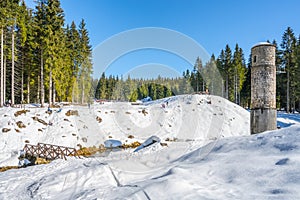 Broken dam in winter mountains