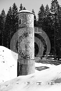 Broken dam in winter mountains