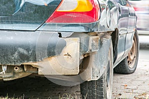 Broken and damaged rear bumper on the car in crash accident or collision in the traffic