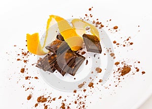 Broken dark chocolate with orange peel