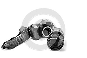 Broken digital SLR camera, dented protective filter on the zoom lens. Will be repaired. Isolated on white background. Front view