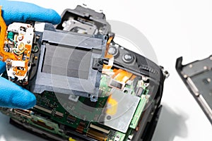 Broken Digital SLR photo camera repair. Replacing the camera shutter.