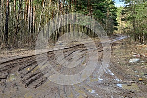 Broken dirt road after heavy rain. Swampy lagoon of a road demonstrates the most common problem in maintaining rural roads