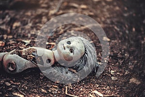 A broken doll in an abandoned kindergarten in the village of Kopachi