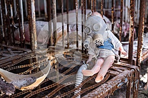 Broken doll in Chernobyl and Pripyat school and kindergarten. Left after nuclear power plant disaster. The exclusion zone, Ukraine