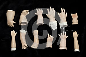 Broken Doll Parts on Black Background