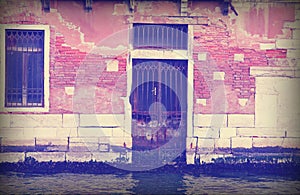 Broken Door in Venice Italy with vintage effect
