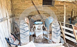Broken down old tractor in barn