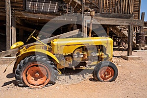 The Broken down vintage tractor, in the tourist trap Goldfield ghost town, an old mining town,