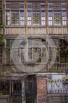 Broken down wooden house facade in tbilisi