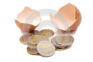Broken egg with euro coins