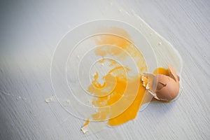 Broken egg on floor.