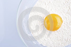 Broken egg on flour, means for making bread