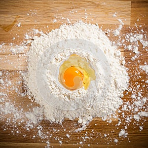 Broken egg on flour, means for making bread