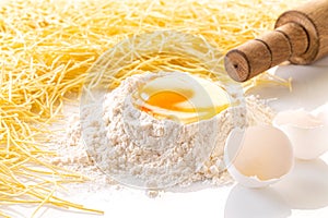 broken egg in flour and pasta