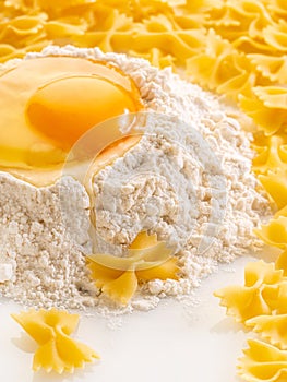broken egg in flour and pasta