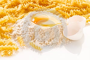 broken egg in flour and pasta