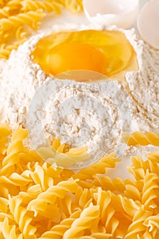 broken egg in flour and pasta