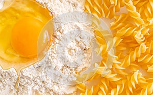 broken egg in flour and pasta