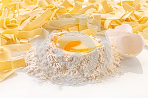 broken egg in flour and pasta
