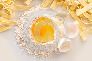 broken egg in flour and pasta