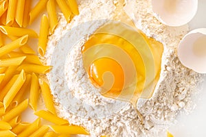 broken egg in flour and pasta