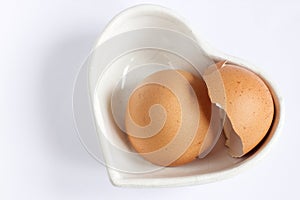 Broken egg shell on the white background.