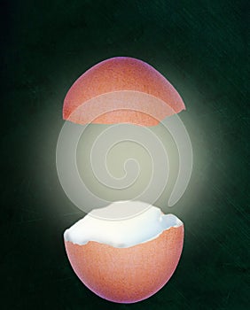 Broken Eggshell With Glow on Chalkboard Background and Copy Space