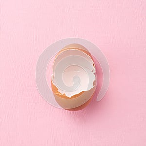 Broken Eggshell on Pink Background