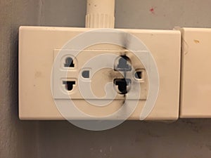 Broken electric socket with electric shock clue