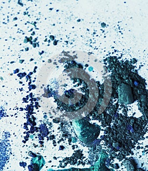 Broken eye-shadows and drops of nail lacquer