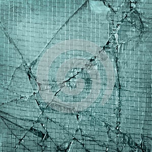 Broken glass,background of cracked window with wir