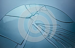 Broken glass background for your images  on white. Many large fragments of crumbled