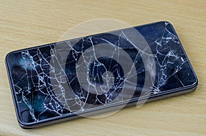 Broken glass on a black smartphone