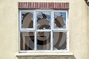 Broken glass after break and vandalism at window