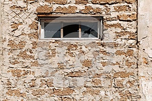 Broken glass in a building window. Housing problems