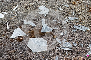 Broken glass on concrete as a result of hooliganism, war or accident photo