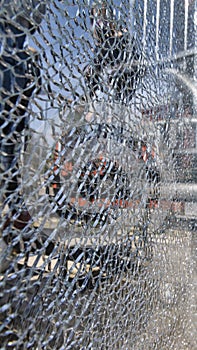 Broken glass fence spider web pattern