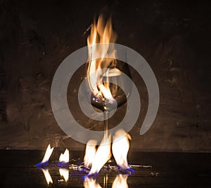 Broken glass on fire on textured background