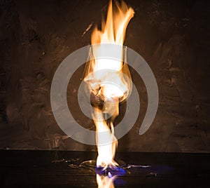 Broken glass on fire on textured background