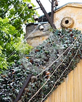 Broken Glass Imbedded in Hanoi Hilton Wall