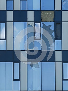 Broken glass on modern building after the hurricane