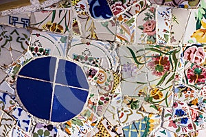 Broken glass mosaic tile, decoration in Park Guell, Barcelona, Spain. Designed by Gaudi